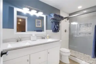 3/4 bath with tiled shower and modern finishes