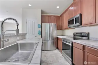 Kitchen has a wonderful farm sink, pantry and lots of counter space.