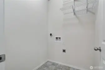 Laundry room with storage.