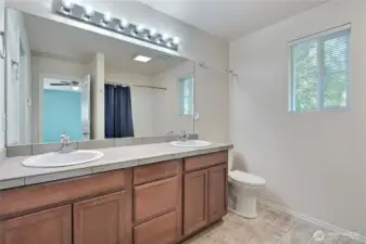 Primary bath has a 2 sink vanity and room for all your bathing needs.