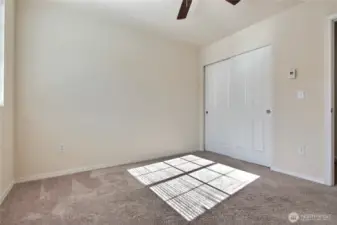 Second bedroom with natural lighting.