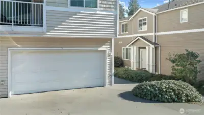 Two car garage with driveway parking for more cars, easy access.