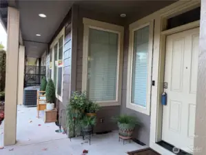 Covered front with a place to sit and come out of the rain