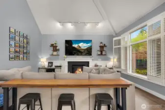 Cozy gas fireplace and built-in surround sound for move night.