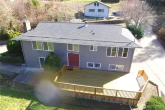 Front of house, deck and detached garage/shop