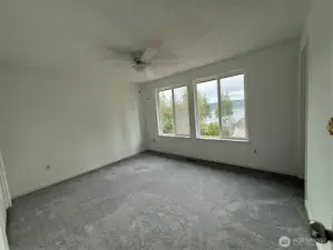 Primary bedroom with view of Hood Canal & Mountain. New carpet too