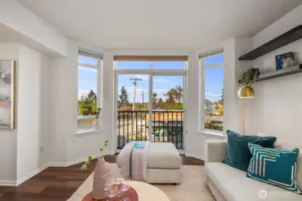 Juliet balcony looks over Greenwood Ave, Olympic Mountains, & sunsets