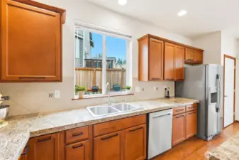 Morning sun streams through the east facing kitchen window ~ perfect for viewing your garden space or flower pots.