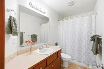 Main upstairs bath is sparkling and fresh.