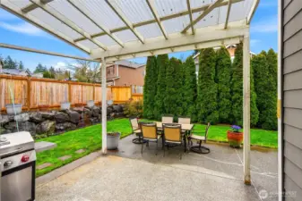 Step outside the breakfast nook to the large covered aggregate patio.