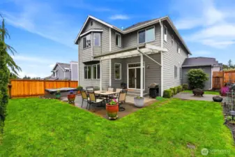Fully fenced back yard is just the right size for fun and play.