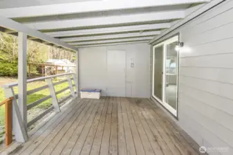 Back porch area with shed attached for added storage space