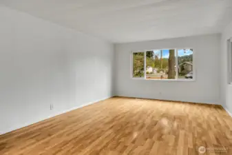 View of main/living room. Plenty of natural light and newer vinyl double paned windows add a fresh feel to the home.