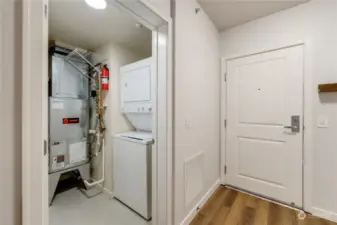 Utility closet with washer and dryer.