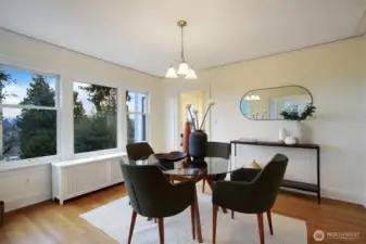 Formal dining room with view - refinished hardwoods, fresh paint. Doorway to kitchen from dining room.