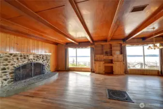 Main house large living room with rock fireplace.