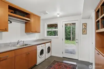 Amazing laundry/mud room with more custom details. En suite off is to the right in this view.