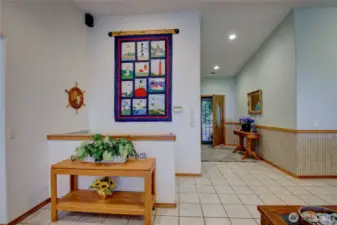 Large welcoming entry and stairs to the lower level