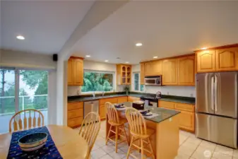 Spacious eat in kitchen at the bar or table and there is a formal dining room as well. Large window at the sink to take in the tranquil scenery