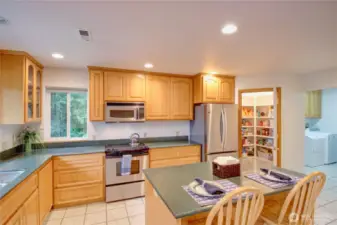 Silestone counter tops, one of two pantry's and the laundry off the kitchen