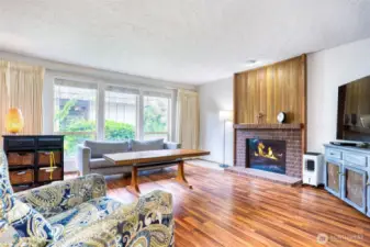Spacious living room with wood burning fireplace