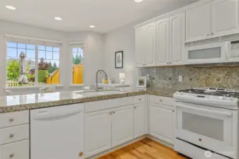 Kitchen with informal dining space, view to patio