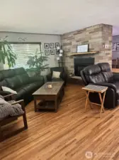 Large living room with gorgeous hardwoods, cozy gas fireplace to keep warm when Fall & Winter arrive!