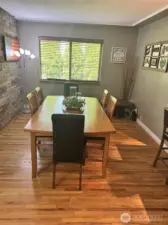 Formal dining area with a window for natural lighting! Plenty of room to add a longer table for gatherings!
