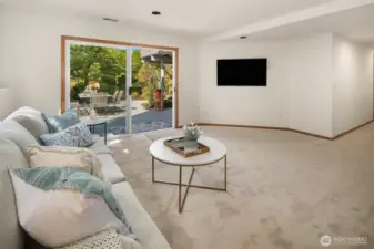 Lower level RecRoom opens to a large tile Patio.