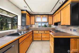 This custom built kitchen with handmade cabinetry built by a master carpenter has tons of creative storage.