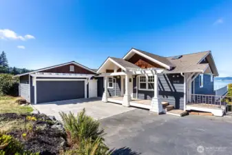 Home garage and driveway and showcasing amazing views