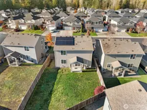 Aerial view showcasing energy-saving solar panels. Your electric monthly payments will be very low.