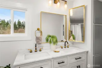 Primary bathroom features a NEW double vanity, NEW mirror, NEW lighting, and a NEW medicine cabinet for a fresh, modern update.