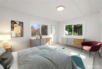 Fourth bedroom features NEW LVP flooring, new lighting, new double-paned vinyl windows, and a large closet for comfortable, move-in ready living.   (photo virtually staged)