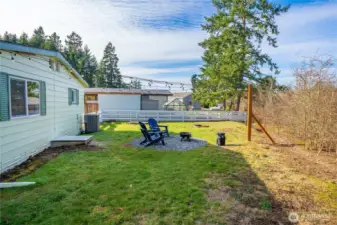 One of the largest backyards in the community, enhanced with NEW outdoor café lights, offers exceptional space for pets, grandkids, and unforgettable evenings outdoors.