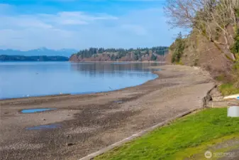 Peaceful shoreline along Puget Sound invites beachcombing, kayaking, and sunset strolls.