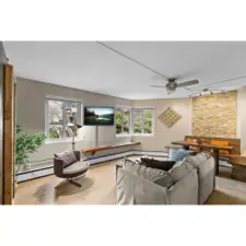 Living room from Hallway.  Digital TV covers wall mount and plug in - needs repair behind TV