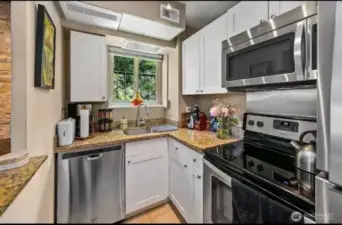 Kitchen with window view of trees