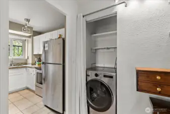 Kitchen and laundry with recently purchased all-in-one washer and dryer