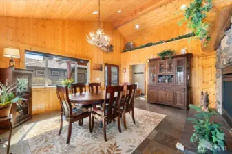 Dining room with slate flooring and Knotty Pine.