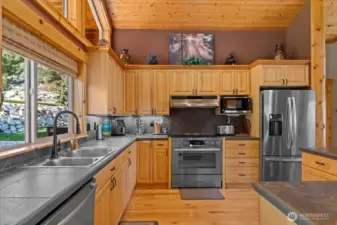 Ample space and plenty of cabinets.  Oven is conventional/convection with induction stovetop.