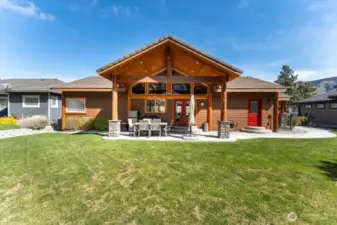 Covered back patio with low-maintenance landscaping.