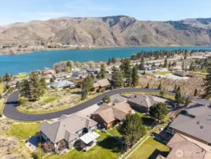 Aerial of home in Shadow Ridge Subdivision with community waterfront & dock below.