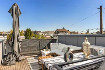 This is what dreams are made of! A spacious rooftop deck with seating/eating area and a separate grilling and storage area. With unparalleled views of the city skyline and the Sound! Your favorite spot during the long and beautiful PNW summer evenings.