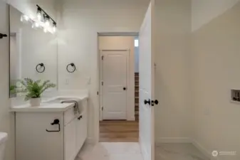 Three quarter bath on Lower Level has convenient laundry hookups.