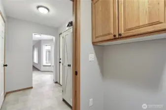 Laundry room separate off garage.