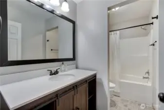 Hall bath with separate shower/toilet room.