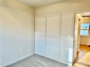 Bedroom #1 with built in closet and drawers.
