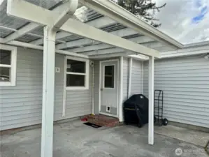 Covered patio accessed through back door.