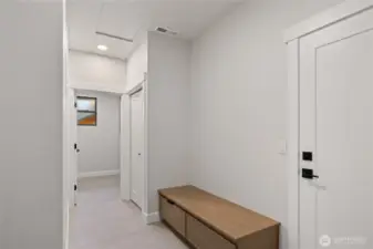Laundry room with built in bench, and laundry sink.